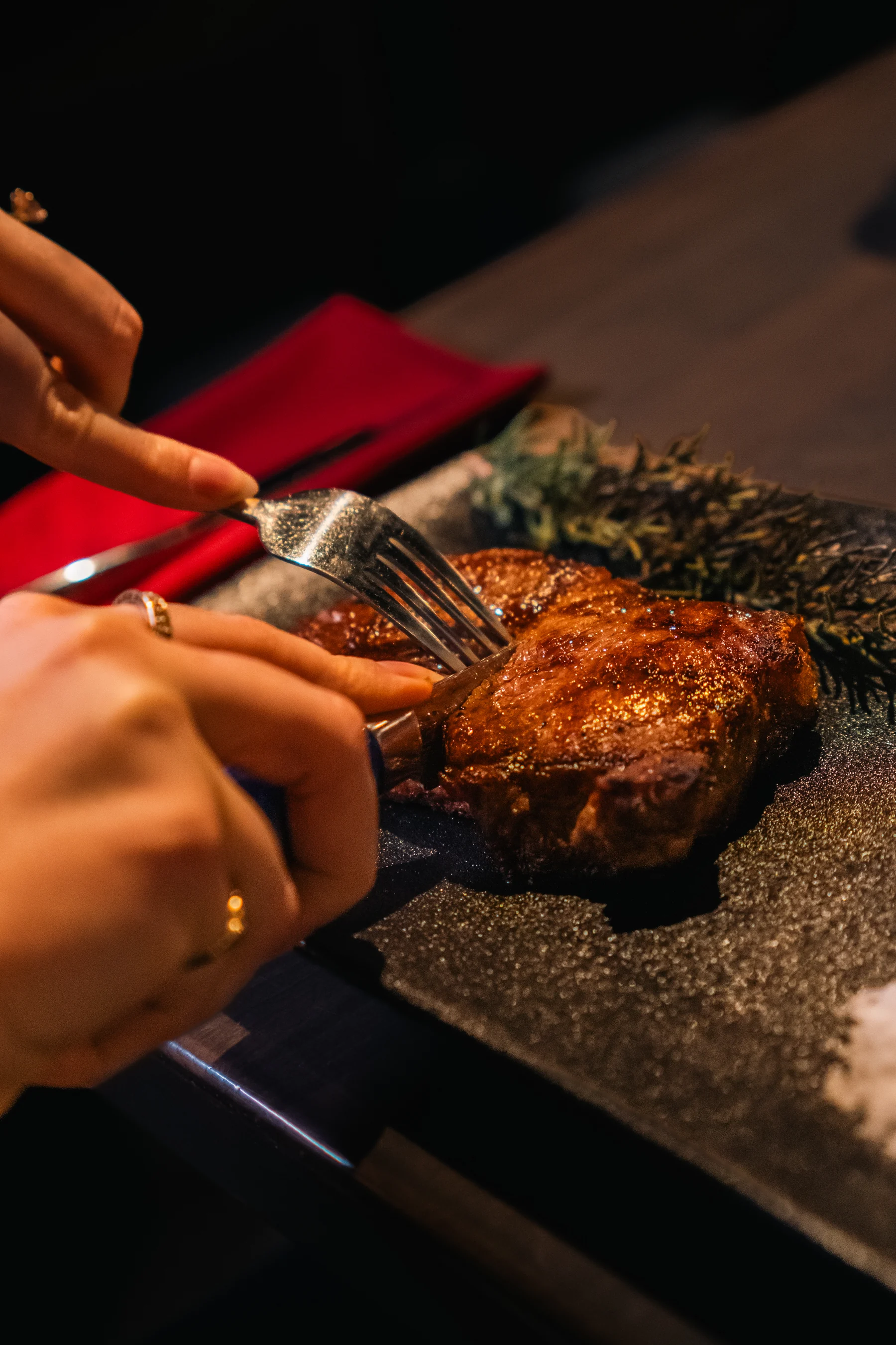 A guest enjoying a steak at Prime