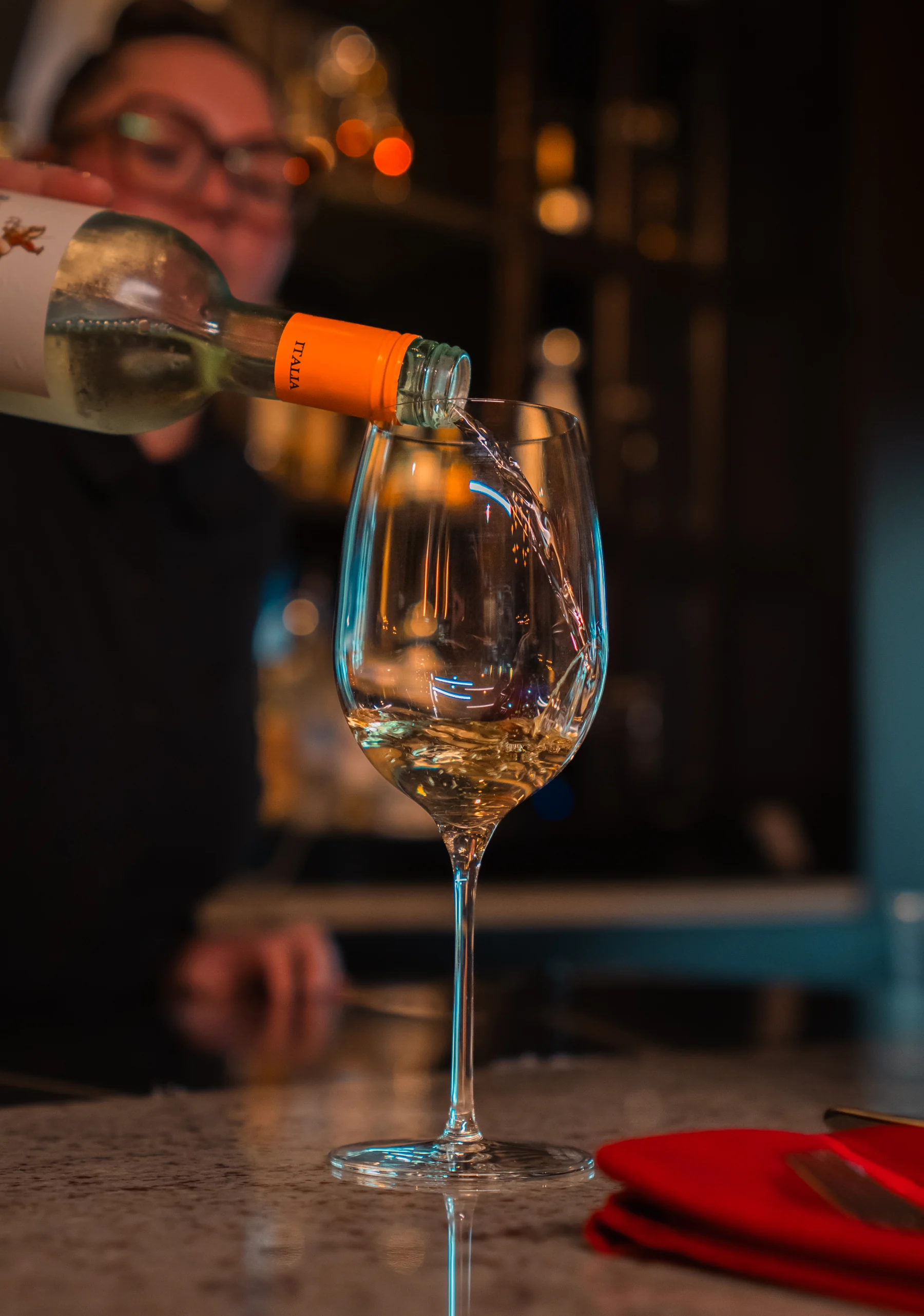 White wine poured at the bar