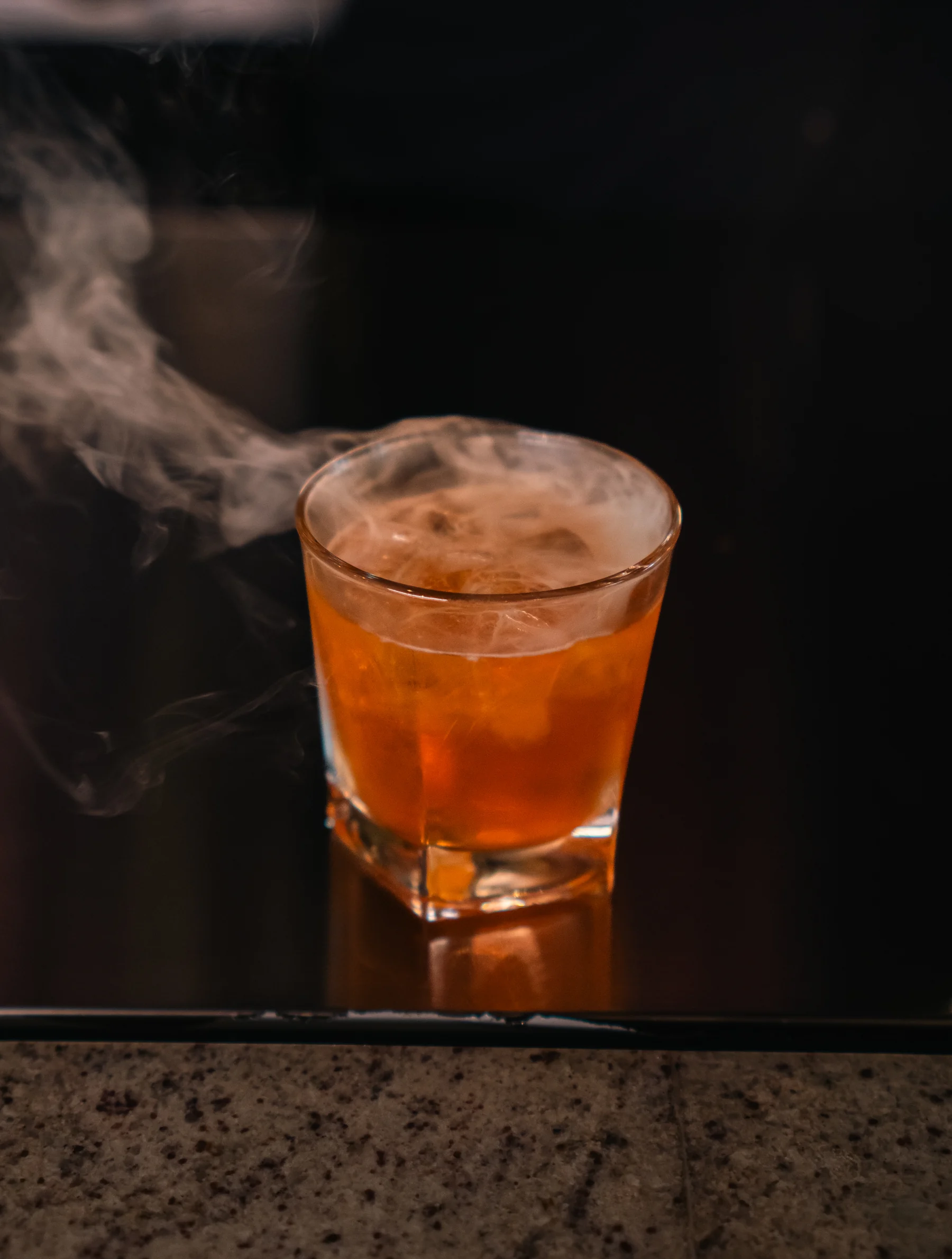 Smoke rising from an Old Fashioned at Prime